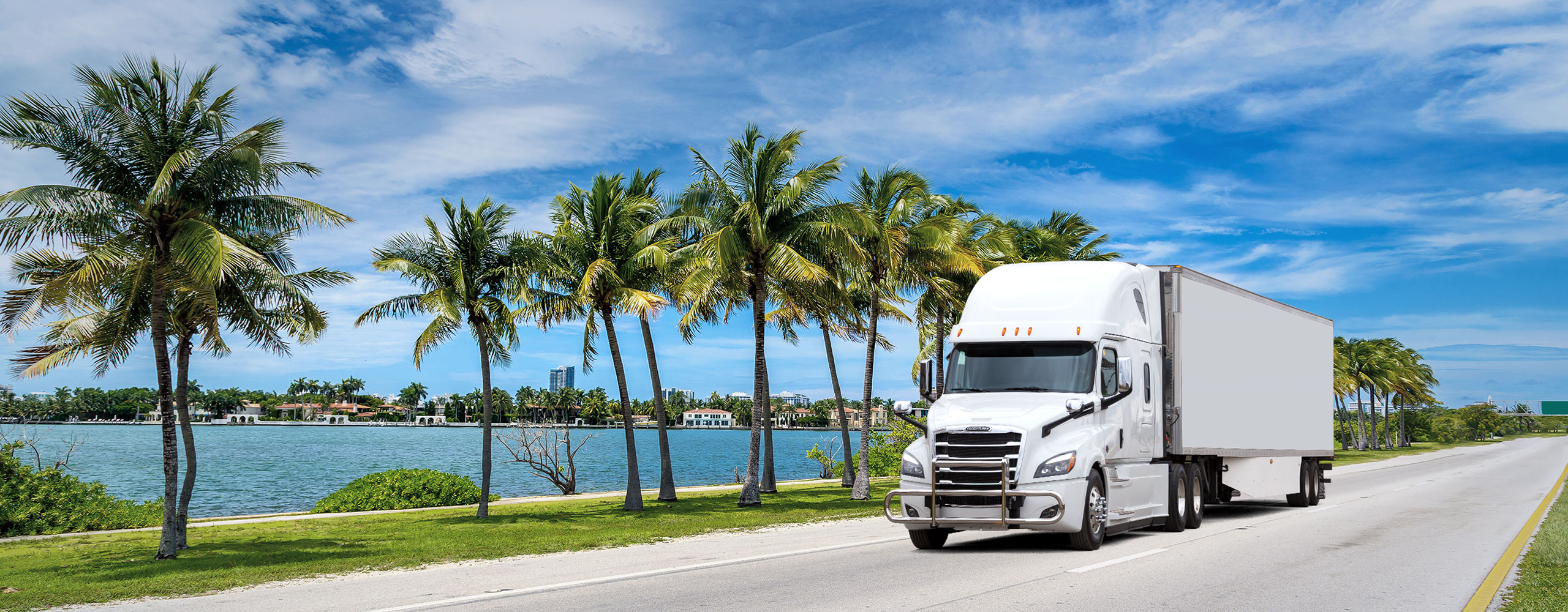 White tractor trailer transporting freight in Florida, USA